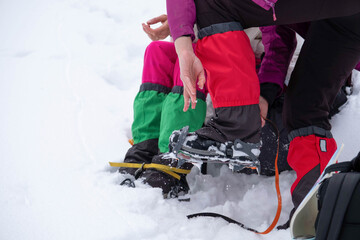 Naklejka premium Mountain hiking gear being put on by a hiker