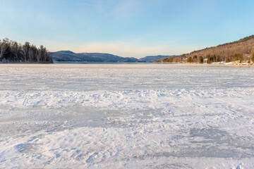 Fototapeta na wymiar A partly frozen lake in Mont-Tremblant, Quebec, Canada