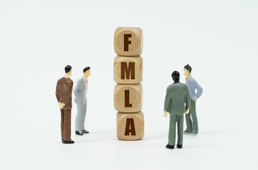 On a white background, figures of businessmen and wooden cubes with the inscription - FMLA