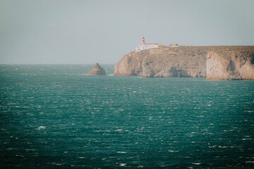lighthouse in the sea on sagres portugal