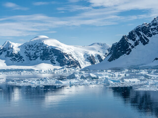 Fototapeta na wymiar Crusing the Lemaire Channel among drifting icebergs, Antarctic Peninsula. Antarctica