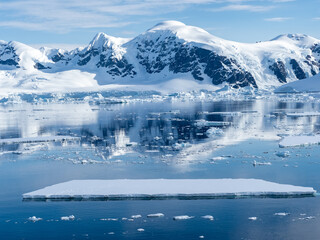 Fototapeta na wymiar Crusing the Lemaire Channel among drifting icebergs, Antarctic Peninsula. Antarctica