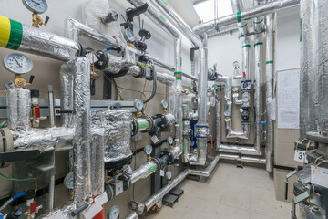 Gas boiler room equipped with a pipe system, pressure gauges and sensors for heating.