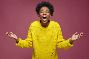 Excited young african american woman fan feel euphoric triumph win, screaming, raised hands