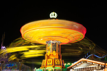 Long exposure of a chain carousel at the Munich Oktoberfest