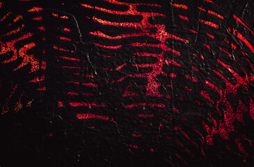 Wall red abstraction. Dark Backgrounds. Lava frozen. Paint spots. Rock surface with cracks. Rock background. Abstract texture. Rock texture. Stone background. Stone texture. Structure.