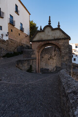 Fototapeta na wymiar Puente Viejo (Old bridge) in the famous white village of Ronda at daylight, Malaga province, Andalusia, Spain