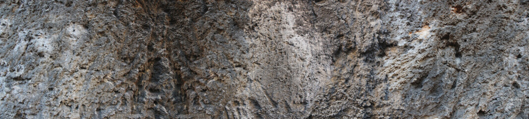 Grunge Rough structure. Silver Wall. Rock background. Rock texture. Black texture. Dark marble. Stone background. Rock pile. Paint spots. Rock surface with cracks. Abstract texture.