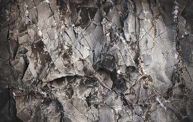 Rock background. Rock texture. Silver Wall. Black texture. Dark marble. Stone background. Rock pile. Paint spots. Rock surface with cracks. Grunge Rough structure. Abstract texture.