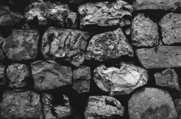 Brick Silver Wall. Rock pile. Rock background. Rock texture. Black texture. Dark marble. Stone background. Paint spots. Rock surface with cracks. Grunge Rough structure. Abstract texture.