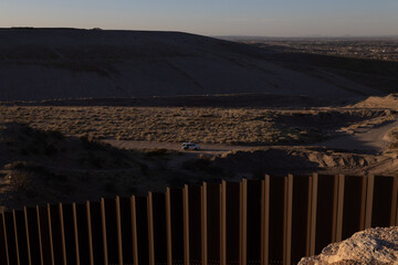 Sunset on the wall that divides the border between Mexico and the United States in Ciudad Juárez Chihuahua and El Paso Texas,