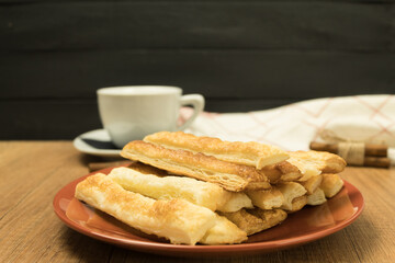 Delicious and sweet puff pastry sticks with cinnamon