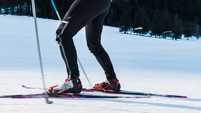 Male practicing skiing as a sport and recreational activity, elements of skate cross country technique.