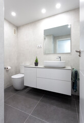 Fototapeta na wymiar White bathroom with dark gray floor