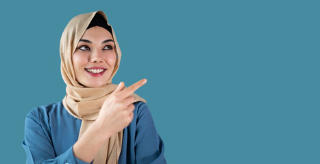 muslim woman showing an product with finger