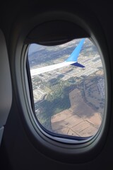 Looking outside a window on plane while flying at low altitude