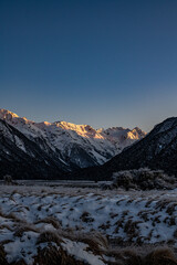 Fototapeta na wymiar Sunset in the mountains in Arthurs Pass, Canterbury, New Zealand