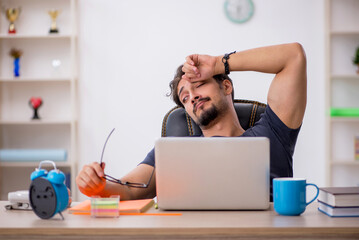Young male designer working in the office
