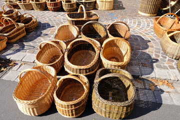 handcrafted from willow twigs, a variety of baskets sold in a market square in Germany, creative weaving from natural materials, true artisans crafting by hand, concept making artisan products