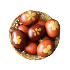  Easter basket. Naturally dyed eggs with onion skins in basket isolated on white background.