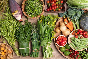 Organic Southeast Asian vegetables, edible flowers and fruits from local farmers market, Northern of Thailand, Sustainability concept, Top view