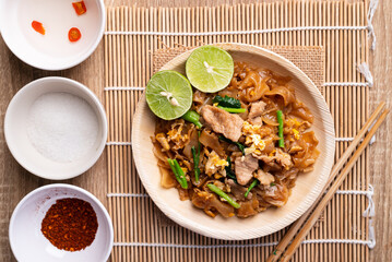 Thai food (Pad See Ew), Stir fried rice noodles with soy sauce, egg, kale and pork, Table top view