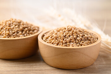 Whole wheat grain in wooden bowl, Food ingredients