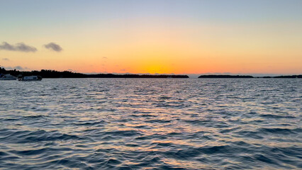 Beautiful sunset over calm ocean water - travel photography