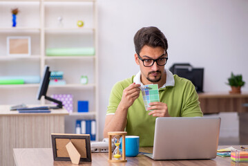 Young male designer working in the office