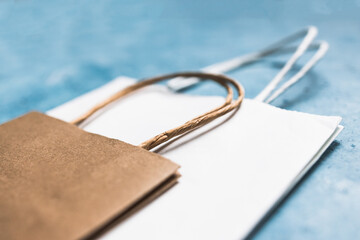 paper shopping bags in different sizes and colours, concept of branding and competition