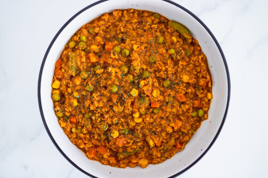 vegan red lentil dahl with mixed veggies, healthy plant-based food