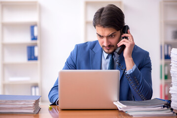 Fototapeta premium Young businessman employee working in the office