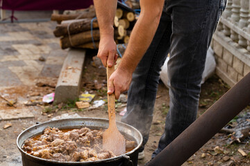 Kavurma is a Turkic sheep meat dish. Pieces of meat are stewed in a large cauldron over an open fire.