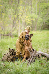 a small child in a beautiful military victory uniform, playing in nature and eating soldier porridge