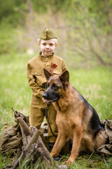 a small child in a beautiful military victory uniform, playing in nature and eating soldier porridge