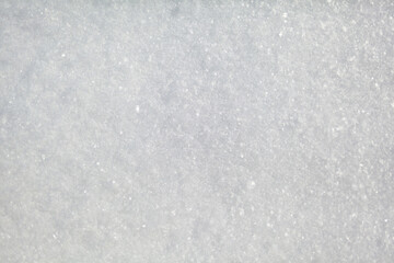 Clean, white snow close-up. Winter background. Snow surface. Fresh fluffy white snow texture.White snowflakes.