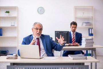Two male colleagues working in the office