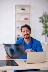 Young male doctor radiologist working in the clinic