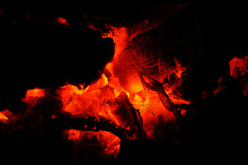 red hot glowing ashes and embers in a wood fire
