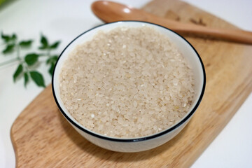 Raw rice is in the bowl.
