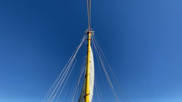 Ships mast against clear blue sky
