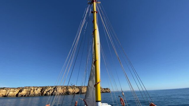 Ships mast against clear blue sky