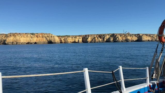 Boat traveling along coast of Portugal