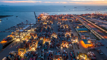 Container ship loading and unloading in deep sea port, Aerial view business commercial trading...
