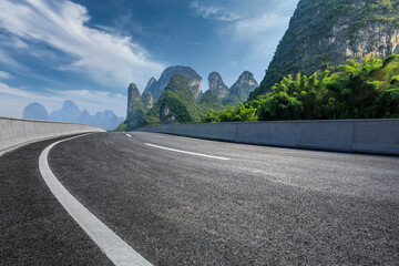Asphalt highway and mountain natural scenery under blue sky in summer