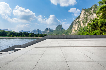Empty square floor and mountain nature scenery in Guilin, China. Road and mountains background.
