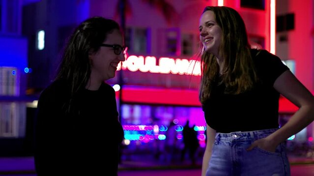 Two girls at Miami Beach at night - the colorful Ocean Drive of South Beach - travel photography
