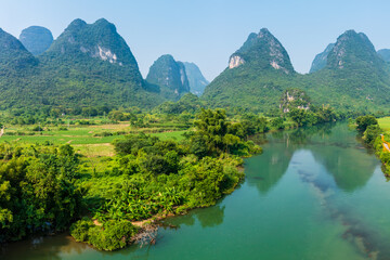 Fototapeta na wymiar Aerial view of beautiful mountain and water natural scenery in Guilin, China. Guilin is a world famous tourist resort. Here are the most widely distributed karst landforms in China.