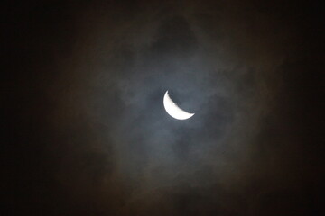 Obraz na płótnie Canvas Waxing Crescent of Moon amidst dark clouds