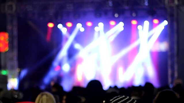 lights And unrecognizable audience at a night concert 